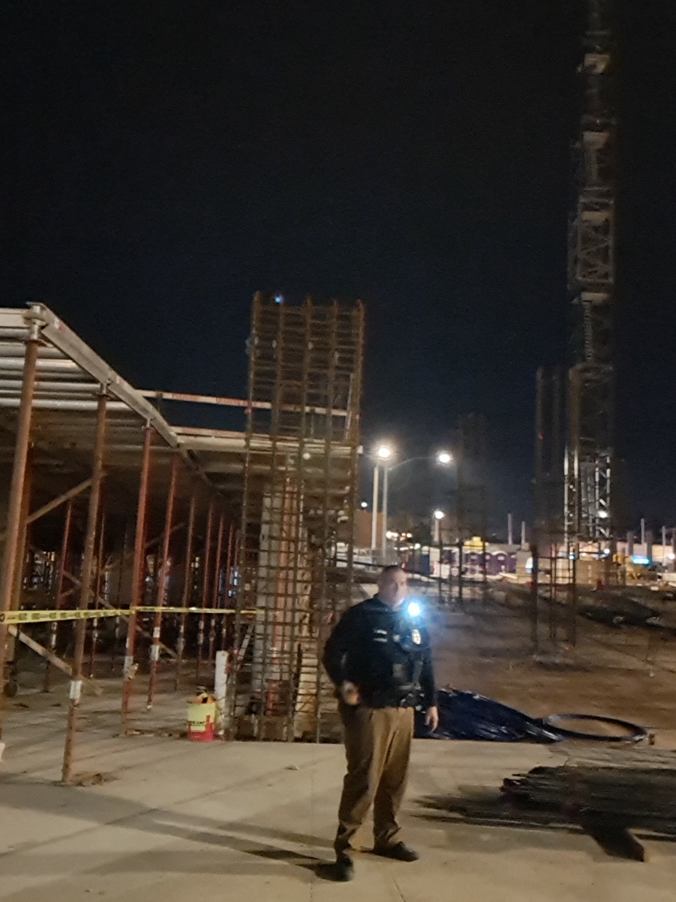 Privateer Security Forces officer patrolling the Ari on Fourth construction site at night