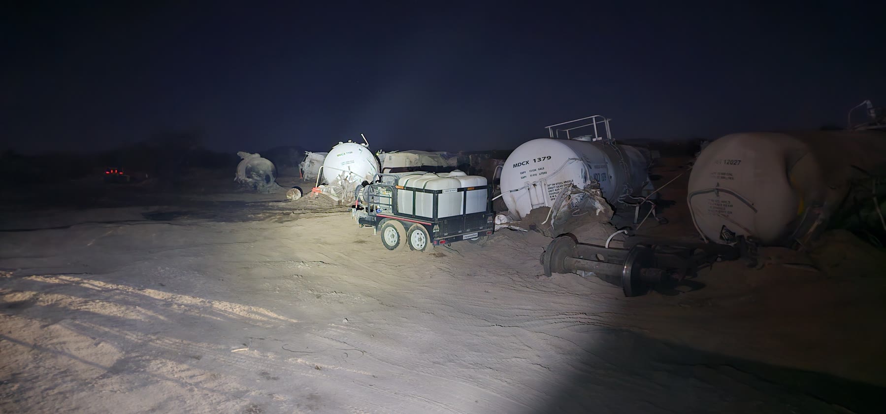 Derailed tank cars at the Green Valley Union Pacific hazardous-material recovery scene at night