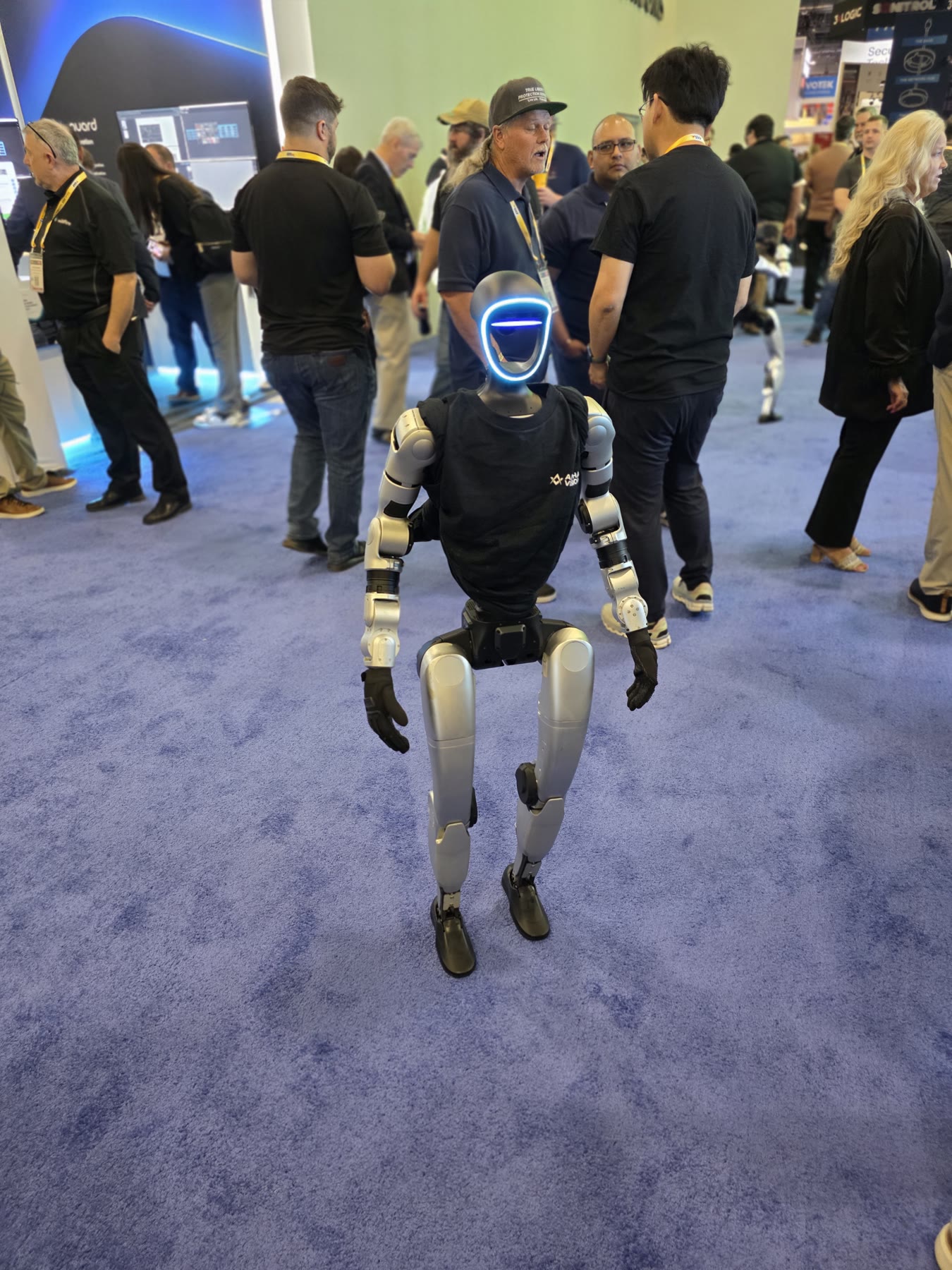 Humanoid robot walking through the ISC West 2026 exhibit hall in Las Vegas