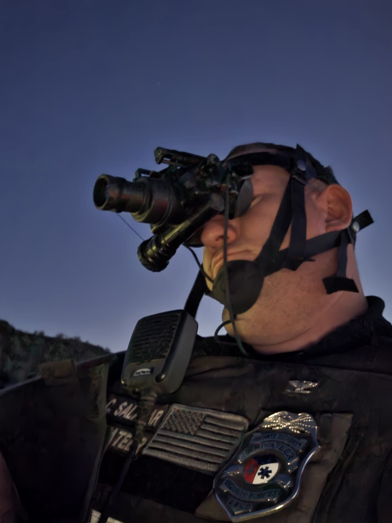 Privateer officer using night-vision equipment during a Menager’s Dam overwatch assignment