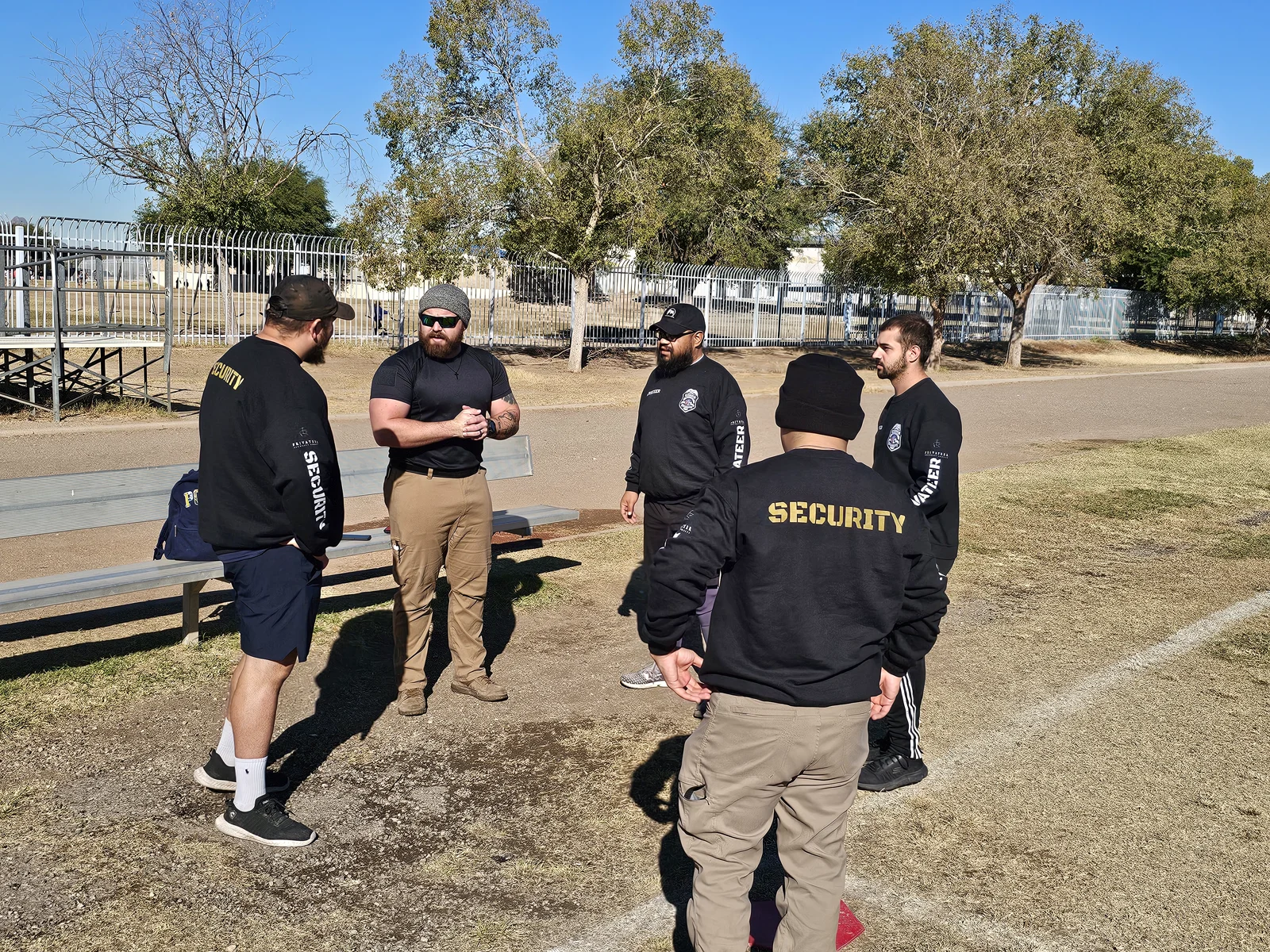 Privateer personnel gathered for an outdoor team briefing in a company archive photograph