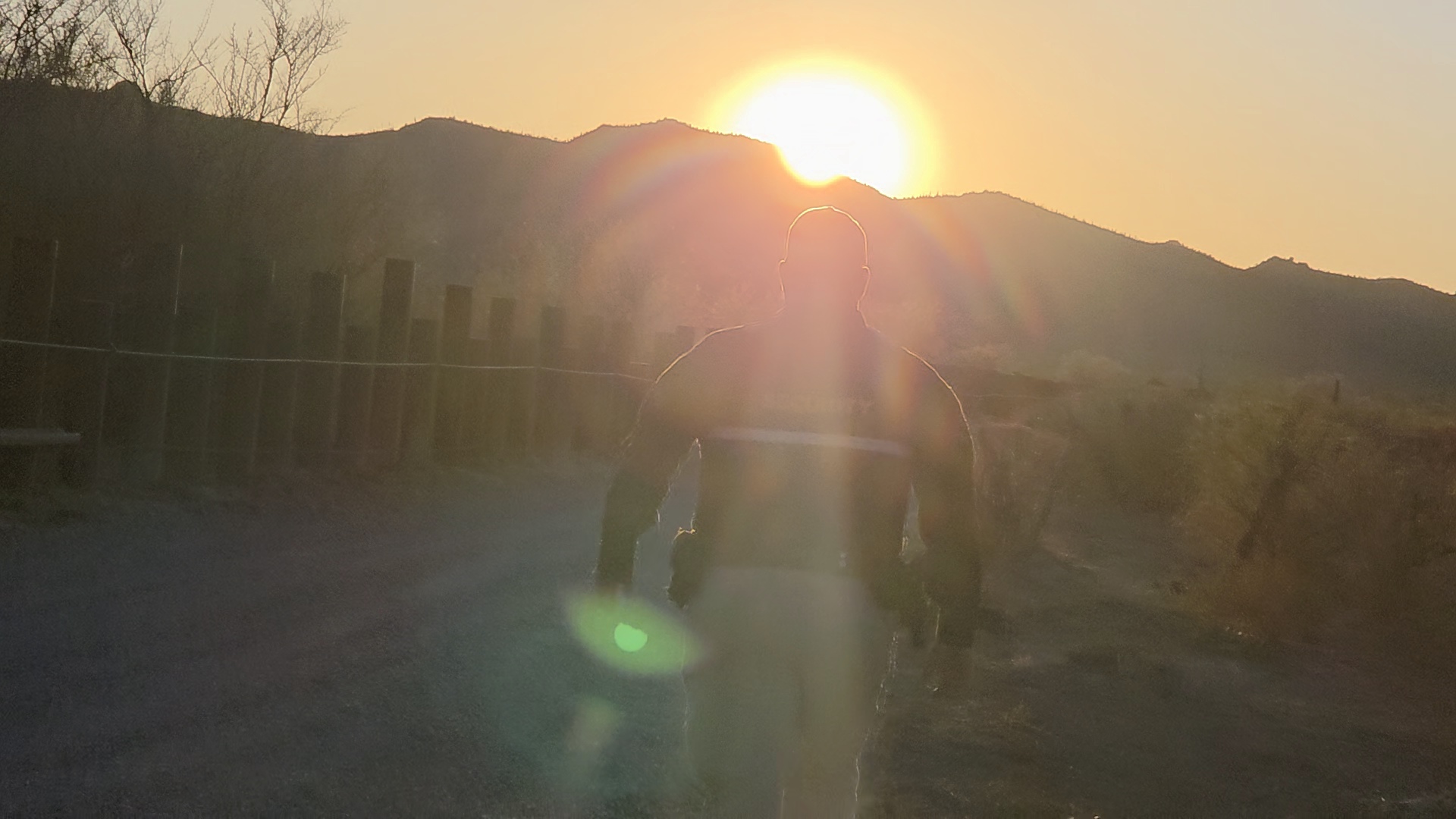 Privateer Security Forces officer at the Menager’s Dam project site beside the U.S.-Mexico border barrier at sunset
