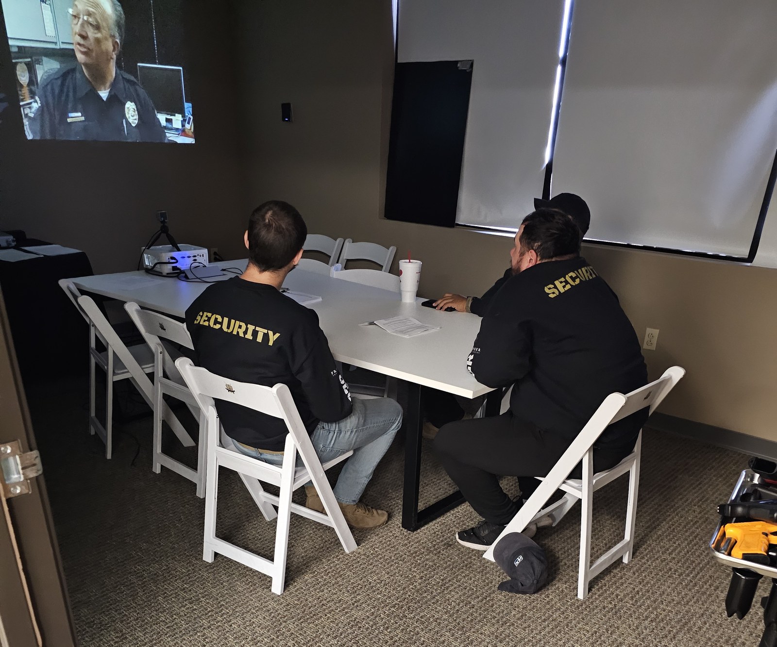 Privateer personnel attending classroom instruction with projected teaching material