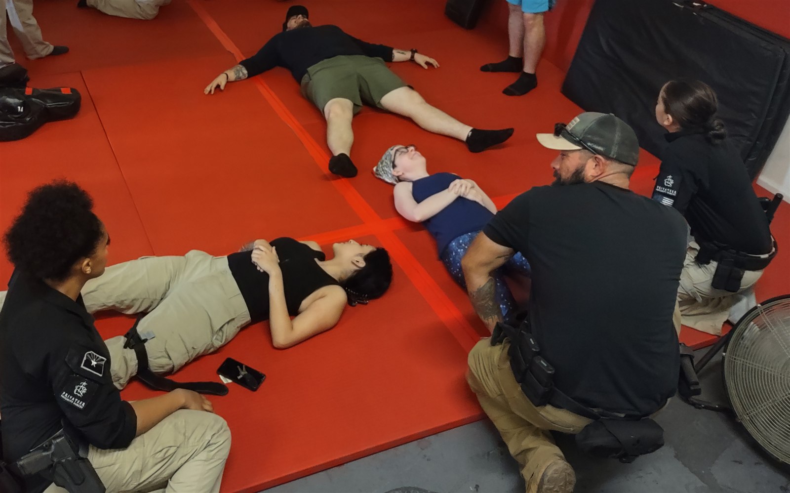 Hands-on instruction at the Privateer academy with participants and instructors on training mats
